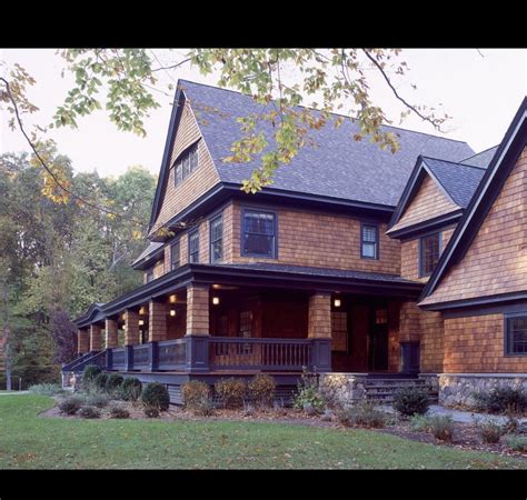 The installation of stucco molding and complex decorative. Cedar house/black trim | Exterior house colors, Shingle ...
