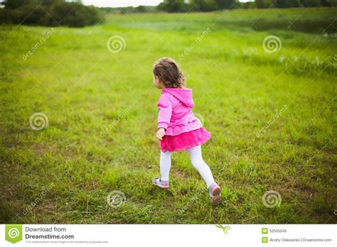 Beautiful Carefree Girl Playing Outdoors In Field Stock Image Image