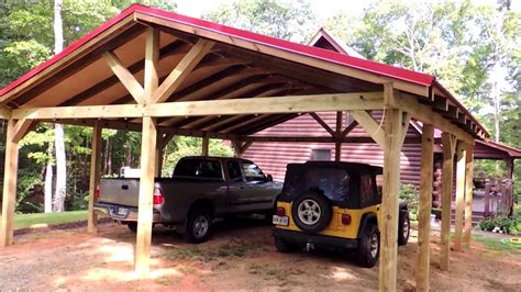 A sleek wooden carport nicely blends into your home surroundings without cluttering your space with massive unattractive metal or brick constructions. Carport Pole Barn Build - YouTube