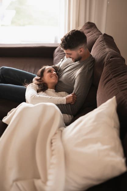 Free Photo High Angle Young Couple Relaxing On Couch