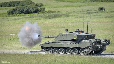 Challenger 2 Tank Firing A Shell A Challenger 2 Tank On Ca Flickr