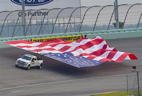 ford smashes chevy s world record as f 450 flies with largest american flag tow ever