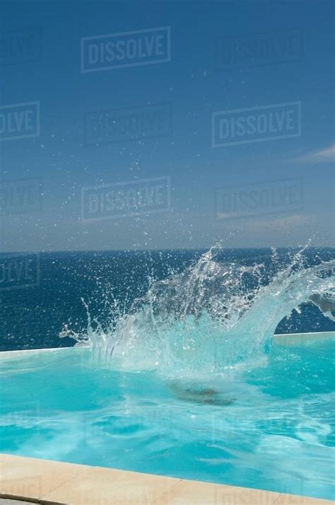 Splashing Water In Swimming Pool Stock Photo Dissolve