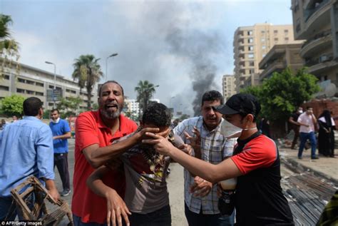 egypt protests angry morsi supports take to the streets and torch government buildings in