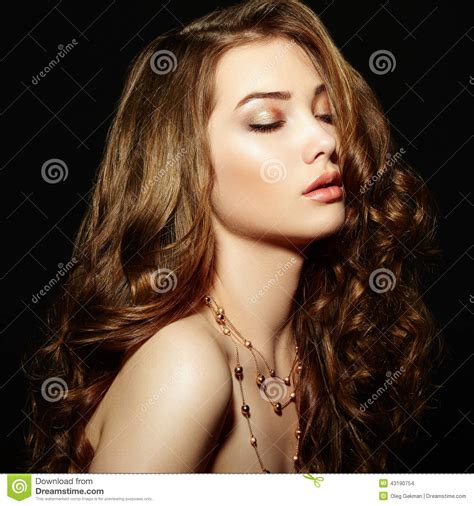 Grey is one of those colors that goes well with all skin tones, and you could rock it if you have dark, olive, light or skin color that is anywhere in between as well. Beauty Woman With Long Curly Hair. Beautiful Girl With ...