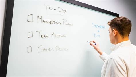 Free Stock Photo Of Young Man Writing Plan And Schedule On Whiteboard