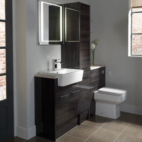 Fitted furniture is amazing for storage solutions in bathrooms of any size; Vetro cinder fitted bathroom furniture Roper Rhodes | Fitted bathroom, Fitted bathroom furniture ...