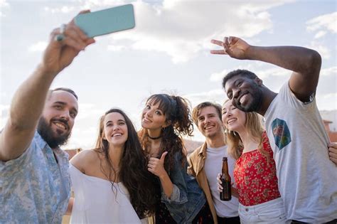 Multiracial Group Of People Taking A Selfie Outdoors Stocksy United