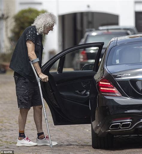 brian may walks with the aid of a crutch as he emerges after heart attack daily mail online