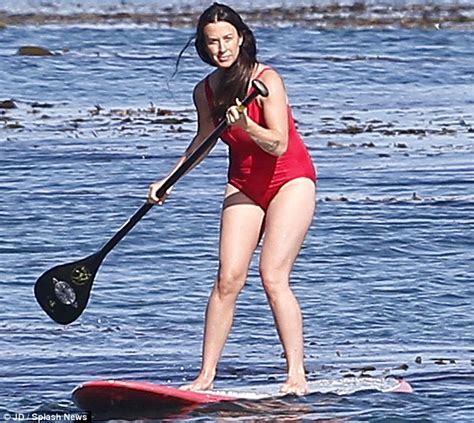 alanis morissette paddleboards in malibu in red swimsuit and no it s not ironic daily mail