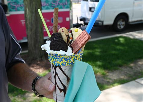Food Truck Tuesday draws a lunch crowd in summer heat. See what