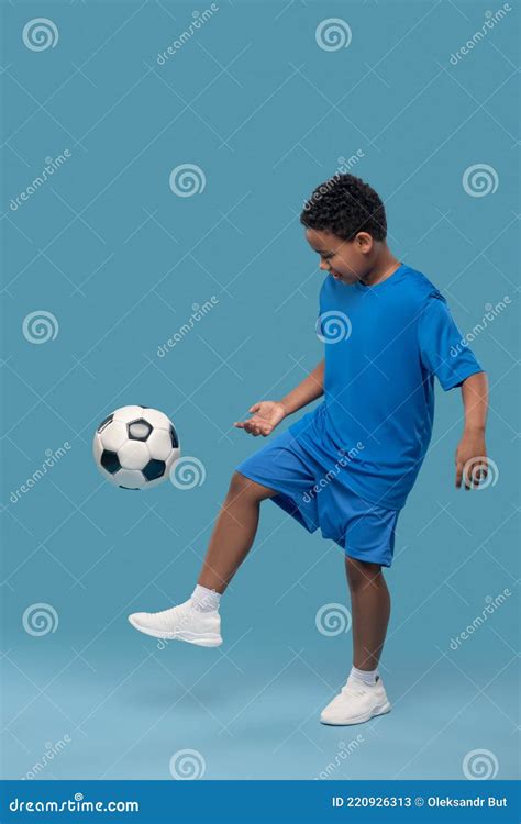 African American Elementary School Boy Playing Soccer Stock Image