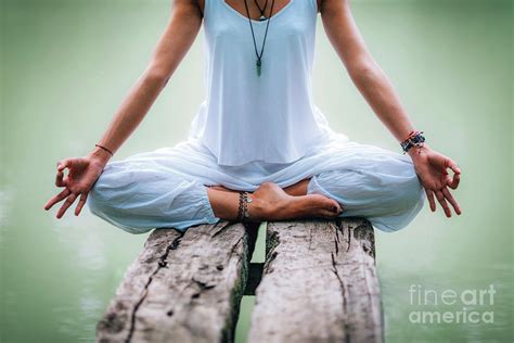 Woman Meditating By A Lake Photograph By Microgen Imagesscience Photo