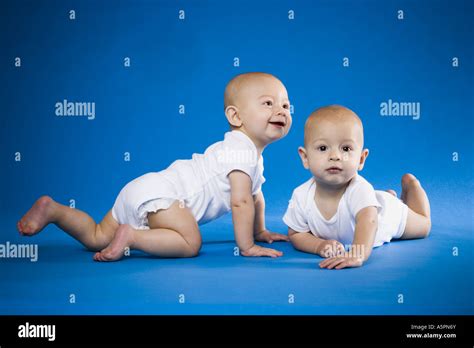 Identical Twin Babies Crawling Stock Photo Alamy