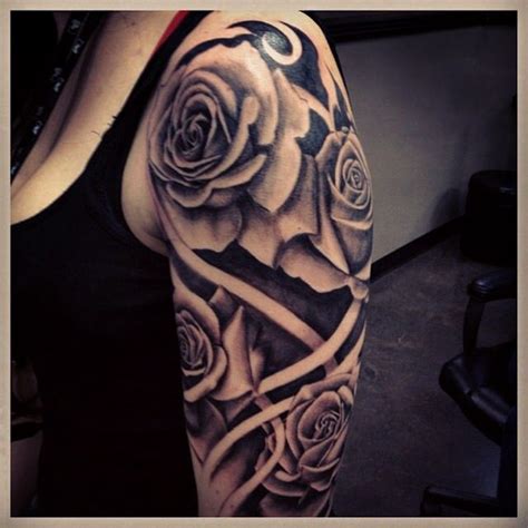 The background of the tattoo is inked black and purple. Rose tattoo. Upper arm placement. | Inked | Pinterest | Roses