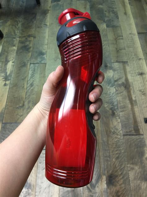 Long And Lean Bottle With Easy Grip Shape And Ribbed Rubber Back Panel