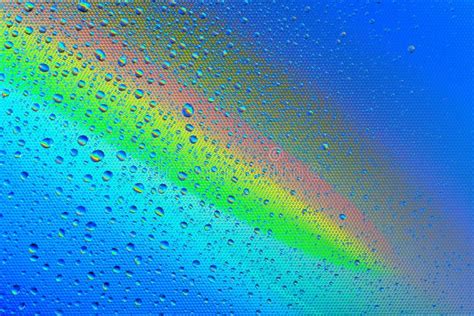 Drops On The Glass Against The Background Of The Rainbow Textur Stock