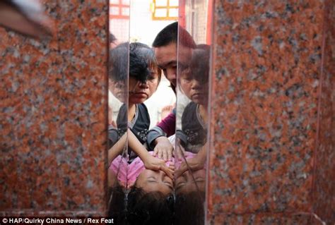 firefighters work to free girl s head caught in a tight spot between two walls daily mail online