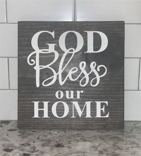 A Wooden Sign That Says God Bless Our Home