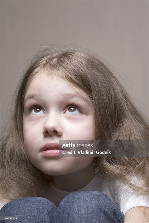 Headshot Of Young Girl Looking Up High Res Stock Photo Getty Images