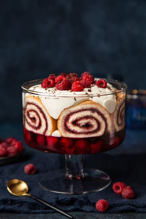 Trifle With Berry Jelly Swiss Roll Cake And Whipped Cream Stock Photo