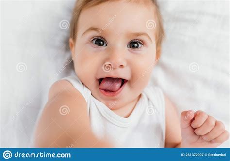 Beautiful Smiling Cute Baby Close Up Portrait Of Happy Lying Baby
