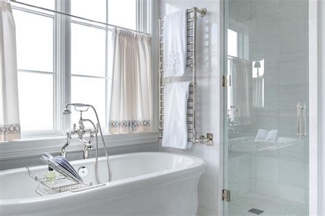 Stacked His And Her Towel Rails Over Vintage Freestanding Bathtub