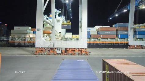 Time Lapse Of Crane Unloading Container Ship With Help From Straddle