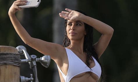 Hot Pictures White Hot Kim Kardashian Flashes Some Serious Underboob In A Racy White Swimsuit