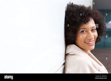 Side Portrait Of Older African American Woman Smiling By White Wall Stock Photo Alamy