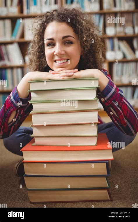 Pretty Student In Library With Pile Of Books Stock Photo Alamy