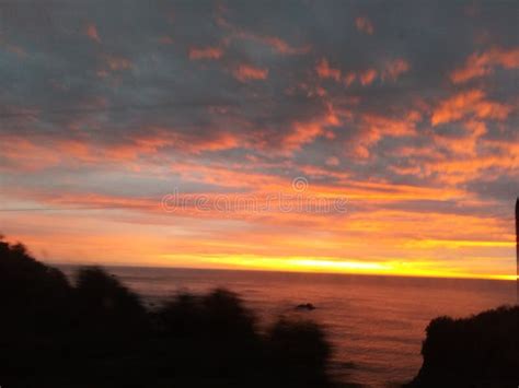 Beautiful Orange Sky Sunset Over The Ocean In California Stock Photo