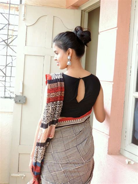 Looking for latest & new high neck designer blouse for sarees? Again me :) Kalamkari saree paired with black boat neck ...