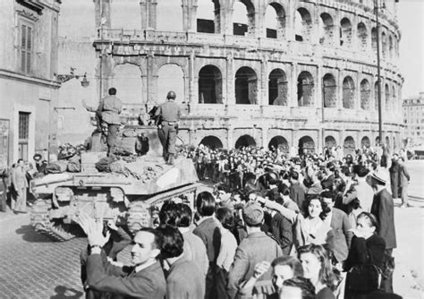 World war 2 was the largest conflict in the whole of world history. A tank and troops of the Allied 5th Army pass cheering civilians by the Colosseum | Rome, Us ...