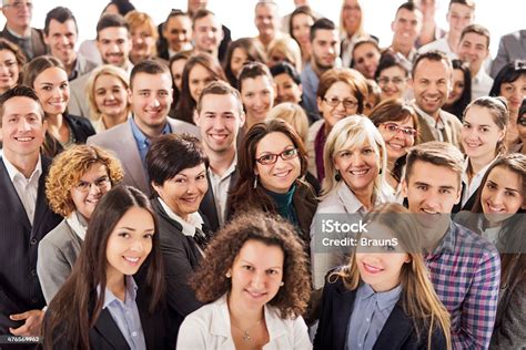 Large Group Of Happy Business People Looking At The Camera Stock Photo