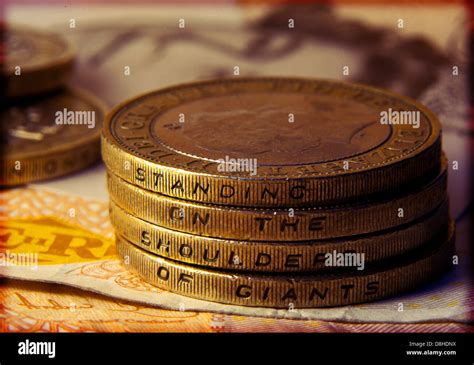 British Two Pound Coins Showing The Words Standing On The Shoulder Of