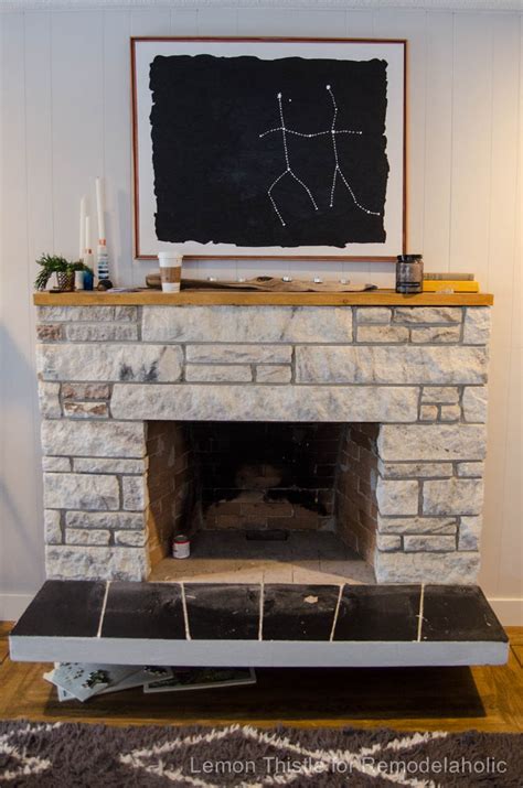 Custom edge hearth and a glass firebox. Remodelaholic | DIY Stone Fireplace Update with Live Edge ...