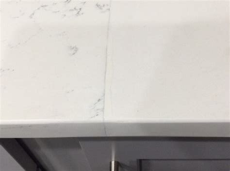 Who ever told you it would be seamless should be beat with a stick. Is this an acceptable seam on quartz countertop?
