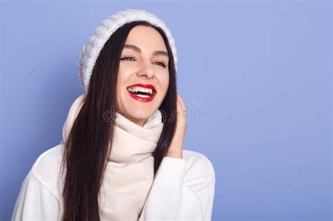 Relaxed Caucasian Woman Wearing White Warm Sweater Standing And