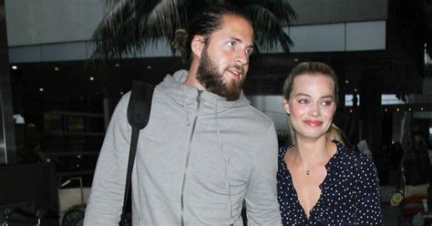 Margot robbie attends the 75th annual golden globe awards at the beverly hilton hotel on 7 margot robbie with her onscreen husband leonardo dicaprio in the wolf of wall street (2013). Who Is Margot Robbie's Husband? Tom Ackerley Also Works In ...