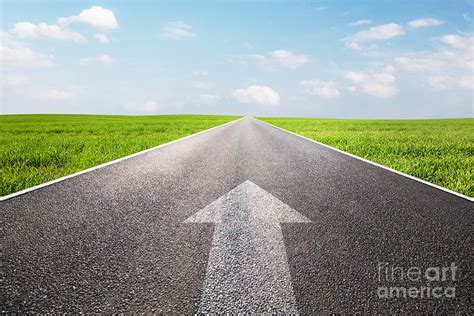 Arrow Sign Pointing Forward On Long Empty Straight Road Photograph By