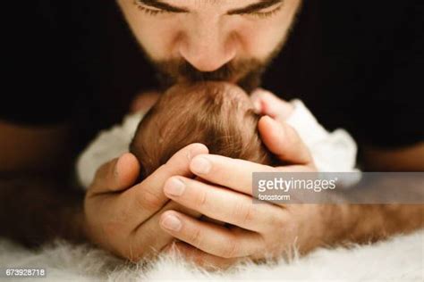 Dad Kissing Baby Hands Photos And Premium High Res Pictures Getty Images