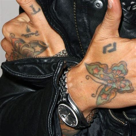 Shopping for butterfly hand tattoo but not sure which one to buy? Linda Perry Butterfly, Writing Back of Hand Tattoo | Steal ...