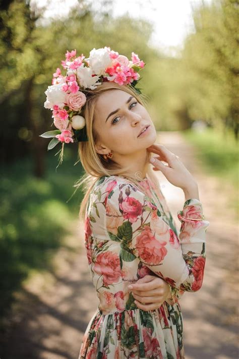 portrait of beautiful blonde woman dressed in flower dress and pink wreath stock image image