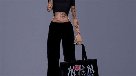 A Woman With Tattoos Holding A Black Bag