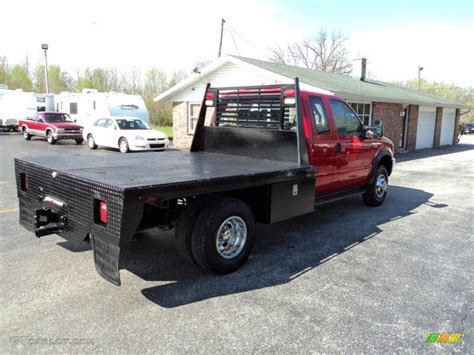 2000 Red Ford F350 Super Duty Lariat Crew Cab 4x4 Dually Flat Bed