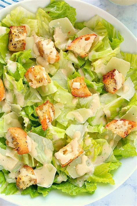 A salad of lettuce and croutons served with a mixture of oil, lemon juice, egg, etc. How to make Caesar salad with croutons and dressing ...