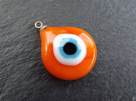 Evil Eye Charm Orange Evil Eye Plump Teardrop Glass Evil | Etsy | Evil eye charm, Evil eye 