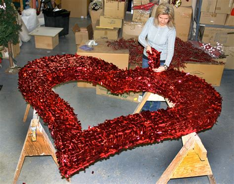 Giant eagle valentine's day flowers. Putting the finishing touches on a giant heart in our ...