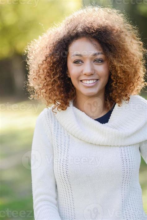 Young African American Girl With Afro Hairstyle And Green Eyes 6521062